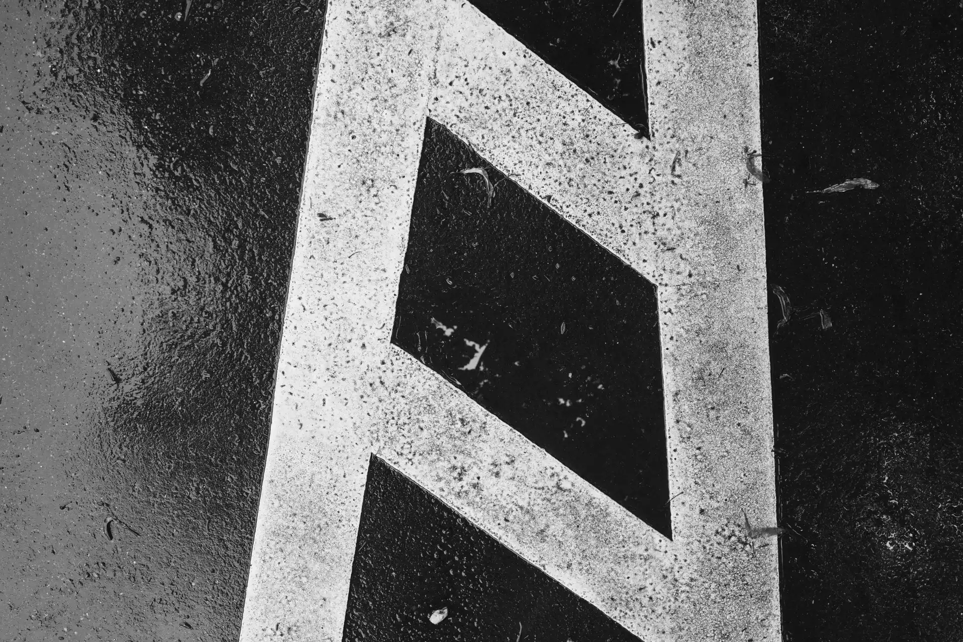 A part of a street marking consisting of two vertical and two horizontal lines.