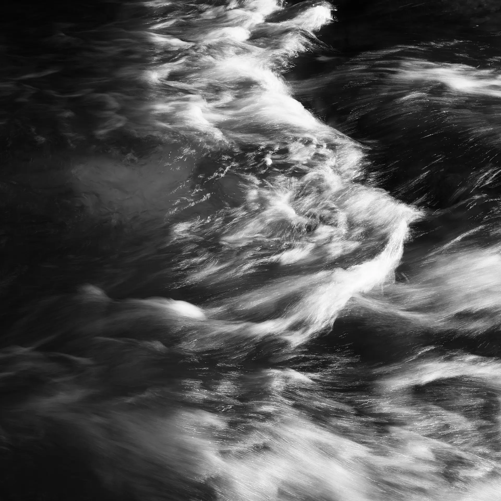 Picture of a river from above with a lot of movement which is highlighted due to slow shutter speed.